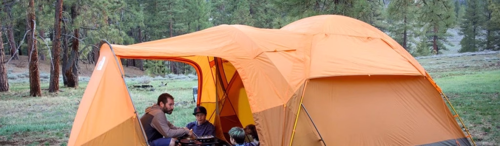 Your Essential Camping Gear List for Beginners: Embrace the Great Outdoors! Father and sons happily camping after packing camping gear list for beginners